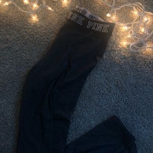 Grey leggings, pink logo waistline